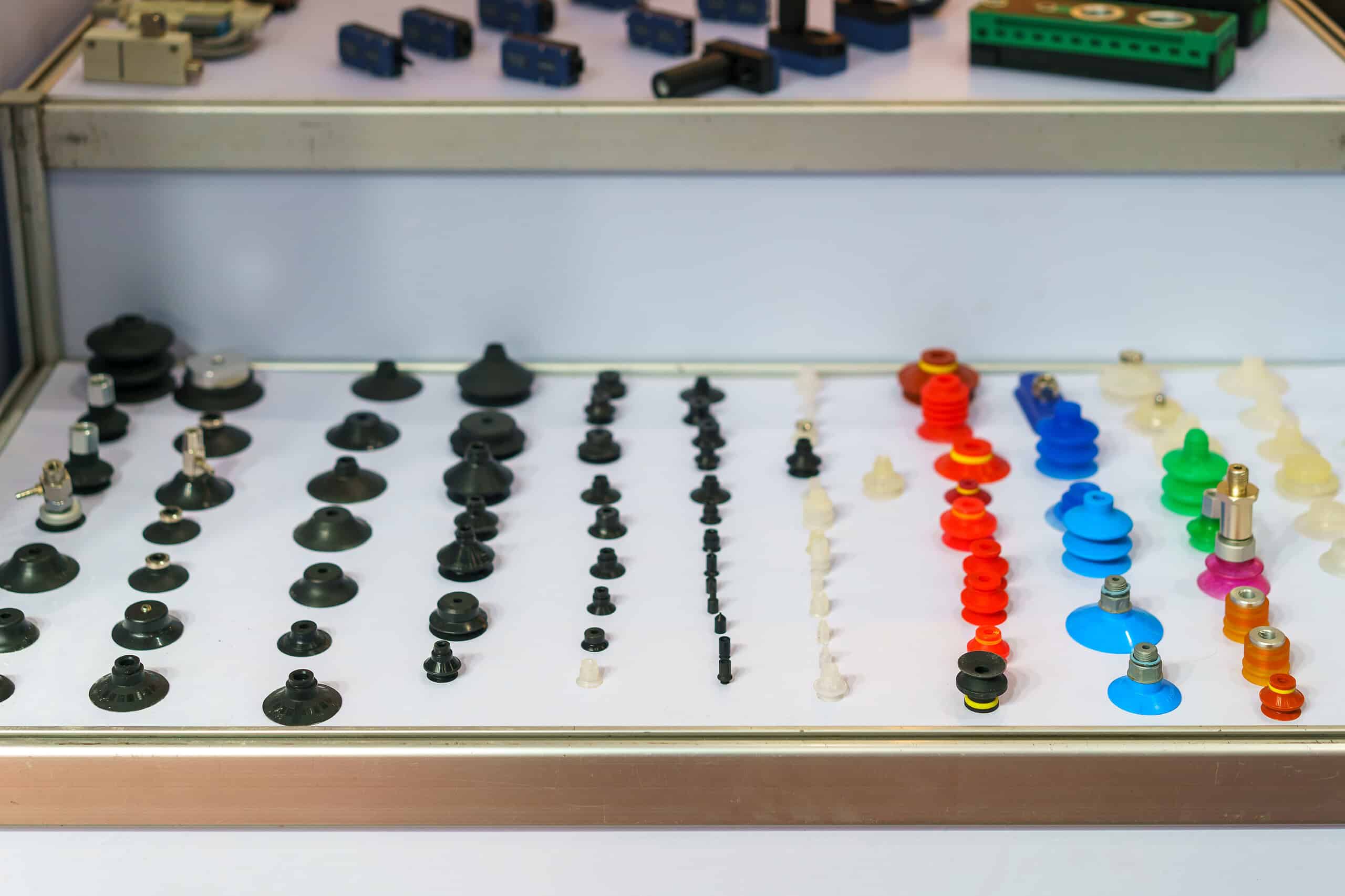 A organized collection of various rubber and silicone suction cups and vacuum grippers for industrial automation, robotics, and material handling systems.